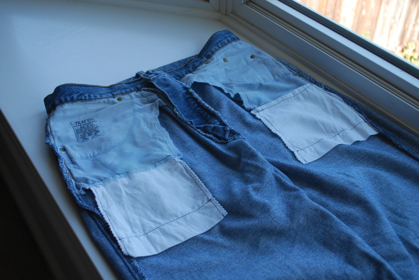Jeans turned inside out, showing the lengthened pocket linings