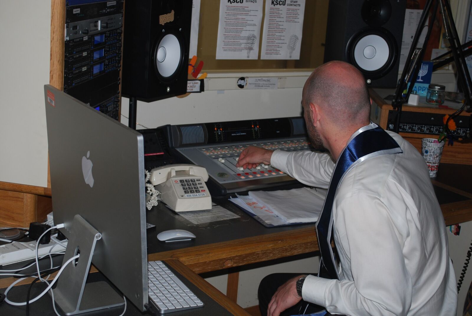 Working the mixing board in the KSCU radio station studio